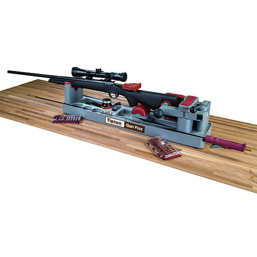 Tipton Gun Vise secures your rifle or shotgun for cleaning and gunsmithing, featuring a rubberized cradle, quick release cam, and compartments for tools.